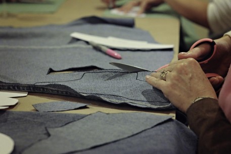 Denim and quilters cotton are traced with markers and cut out with fabric scissors