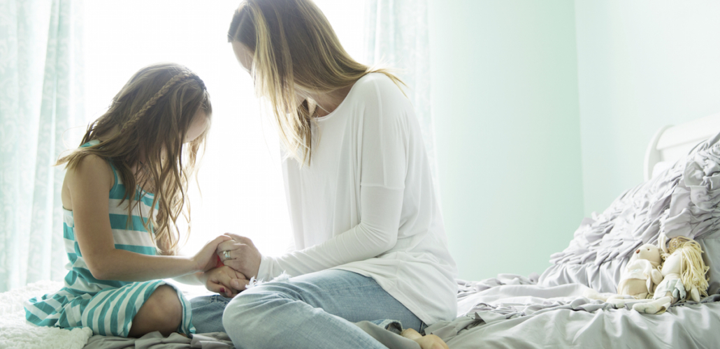 Mom and Daughter Praying