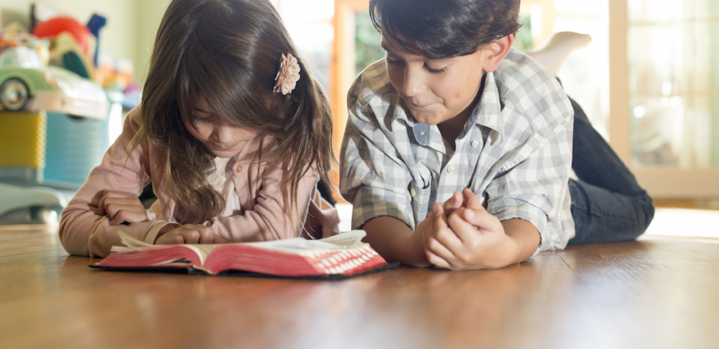 Siblings with Bible